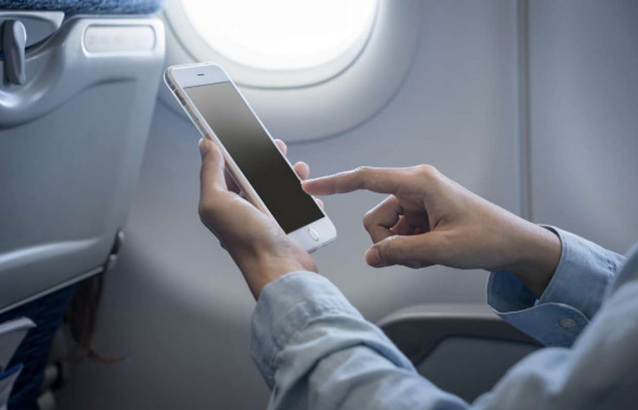 Using mobile devices on plane and travel etiquette DadLife Magazine