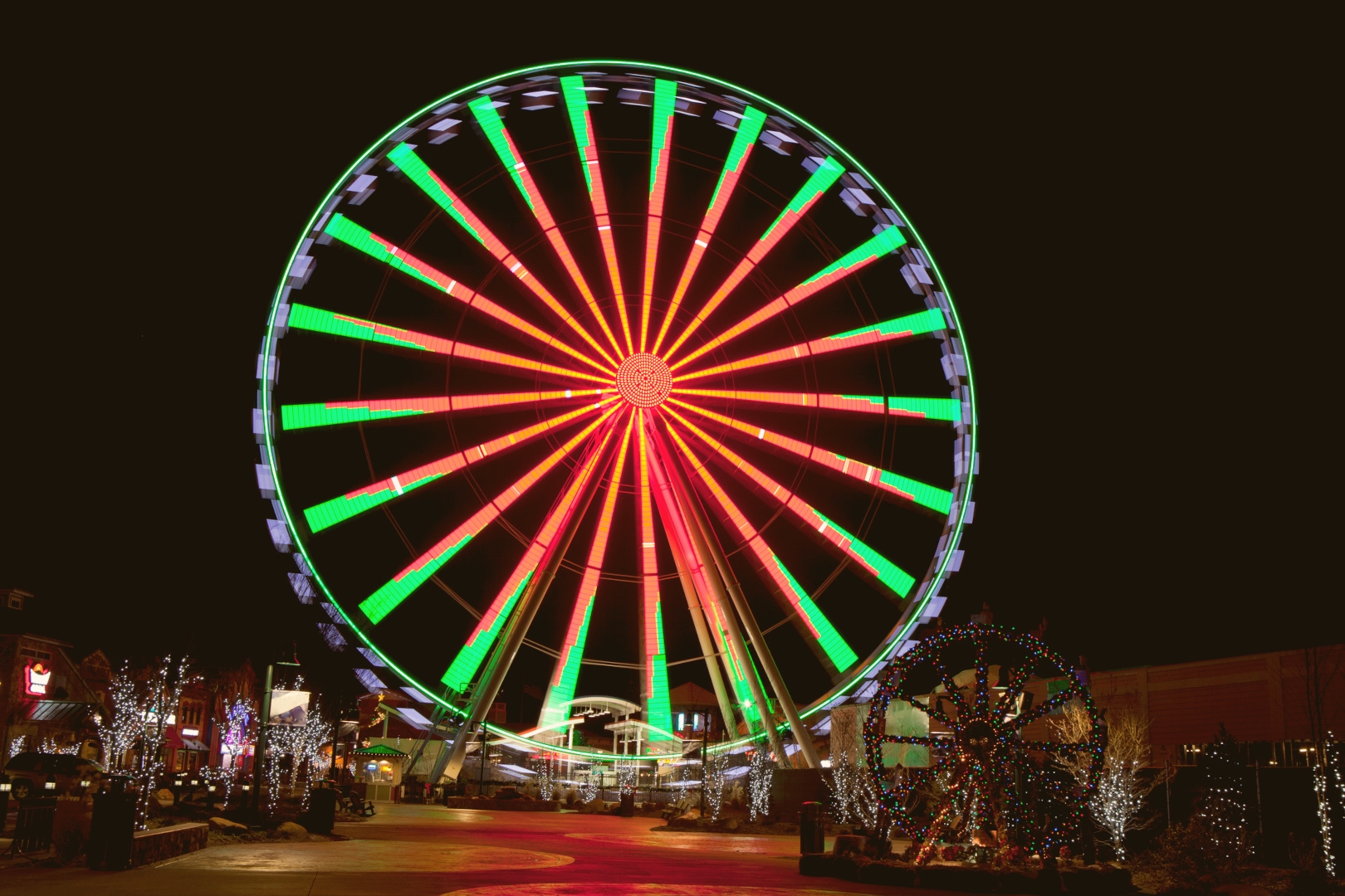 The Great Smoky Mountain Wheel, a ferris wheel in Pigeon Forge, TN, lit up at night for Christmas