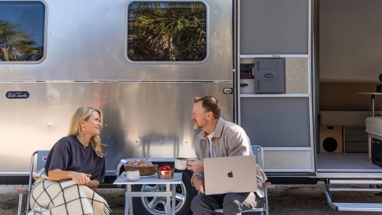 A couple enjoying outdoor living at their campsite